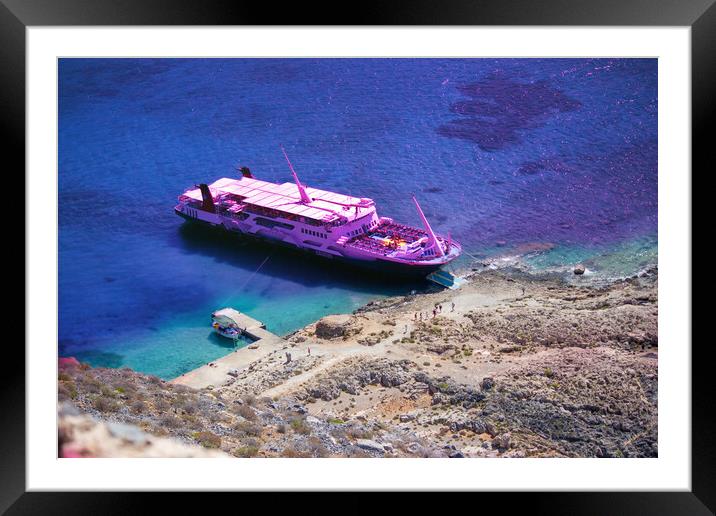Crete, Greece: A cruise ship docked in Imeri Gramvousa in the small uninhabited islands off the coast of a peninsula also known Gramvousa Peninsula in the regional unit of Chania Framed Mounted Print by Arpan Bhatia