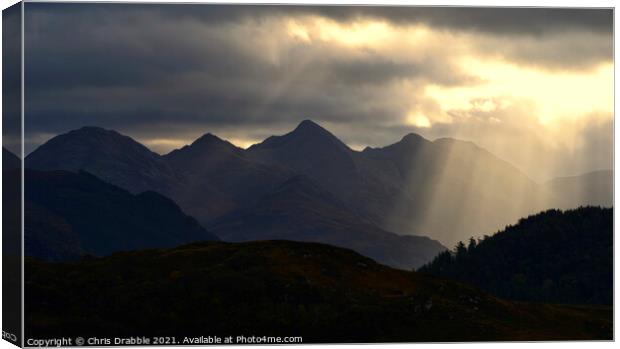 The Five Sisters of Kintail illuminated in light r Canvas Print by Chris Drabble