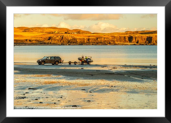 Launching a boat from Bharcasaig Beach. Framed Mounted Print by Richard Smith