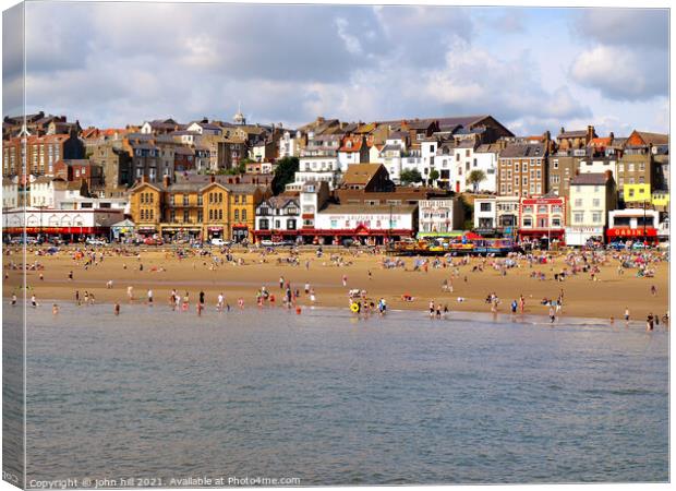 Scarborough seafront from the pier in August. Canvas Print by john hill