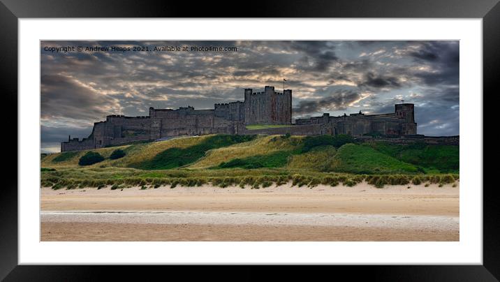 Bamburgh castle from the beach Framed Mounted Print by Andrew Heaps