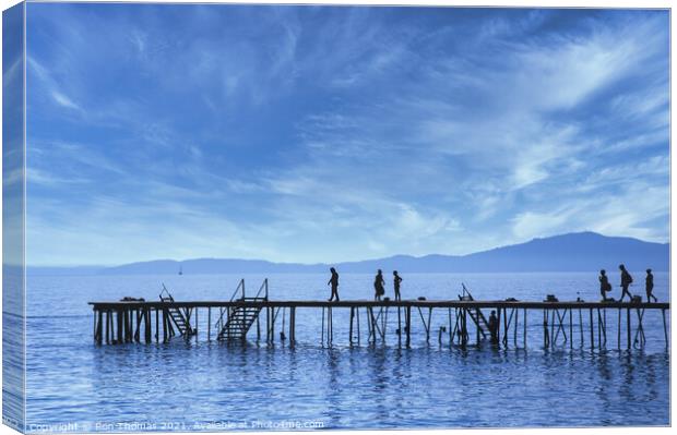 Silhouettes on a Wooden Pier in Corfu. Canvas Print by Ron Thomas