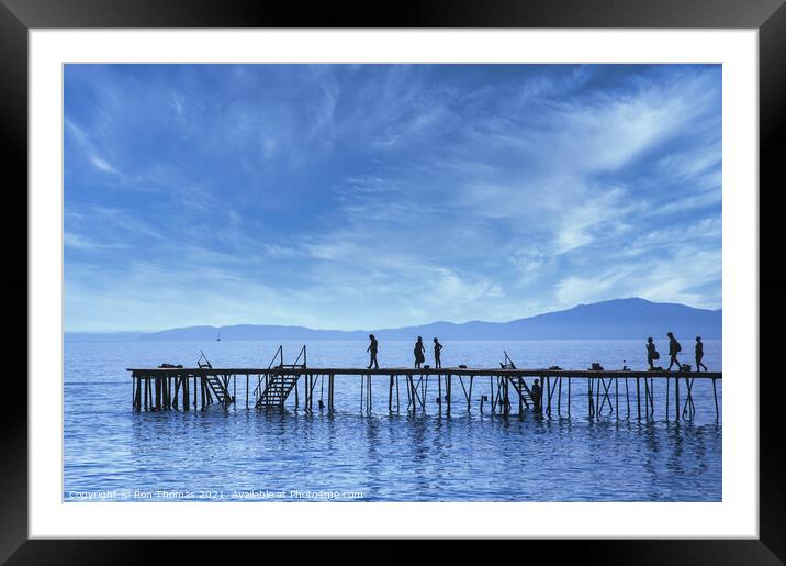 Silhouettes on a Wooden Pier in Corfu. Framed Mounted Print by Ron Thomas