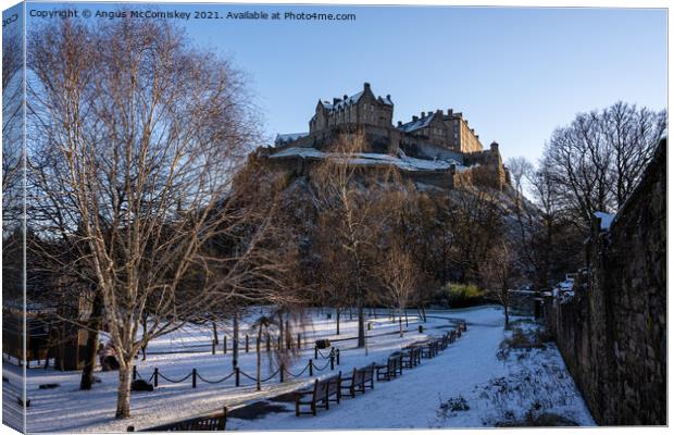 Edinburgh Castle snow from Princes Street Gardens Canvas Print by Angus McComiskey