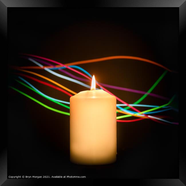 Candle with streaks of light Framed Print by Bryn Morgan