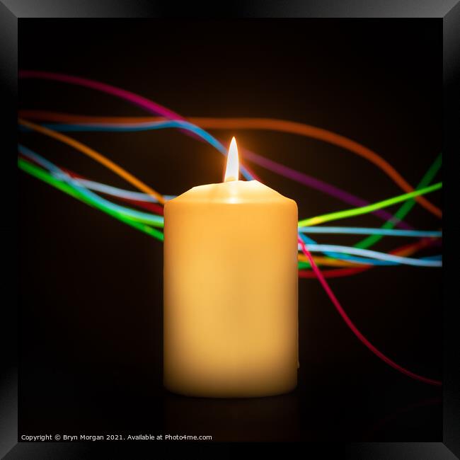 Candle with streaks of light Framed Print by Bryn Morgan