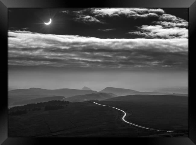 Moon shadow (Solar eclipse).  Framed Print by John Finney