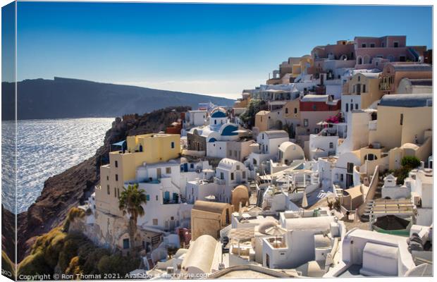 Oia rooftops Canvas Print by Ron Thomas