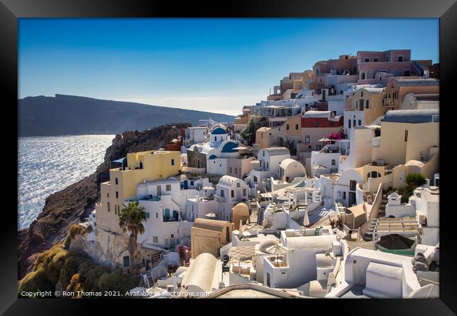 Oia rooftops Framed Print by Ron Thomas