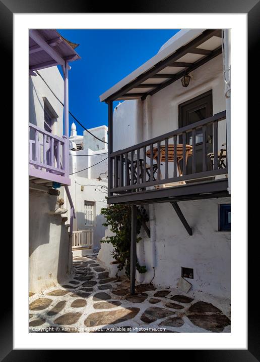 A Narrow Street in Mykonos, Greece. Framed Mounted Print by Ron Thomas