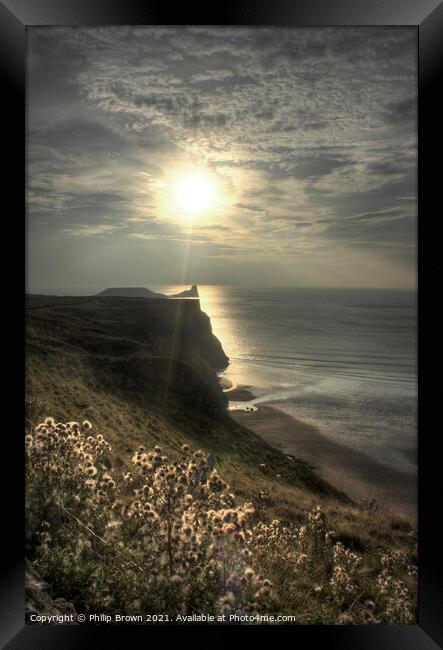 Sun setting across Worms Head, Rhosilli, The Gower Framed Print by Philip Brown