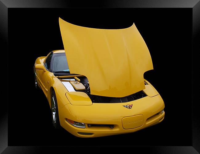 Yellow Corvette on black background Framed Print by Allan Briggs
