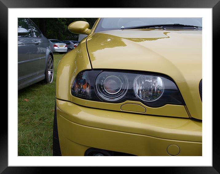 Gold BMW headlight close up Framed Mounted Print by Allan Briggs