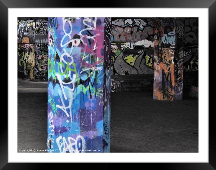 A graffiti covered walls and pillars of  London Framed Mounted Print by Kevin Plunkett