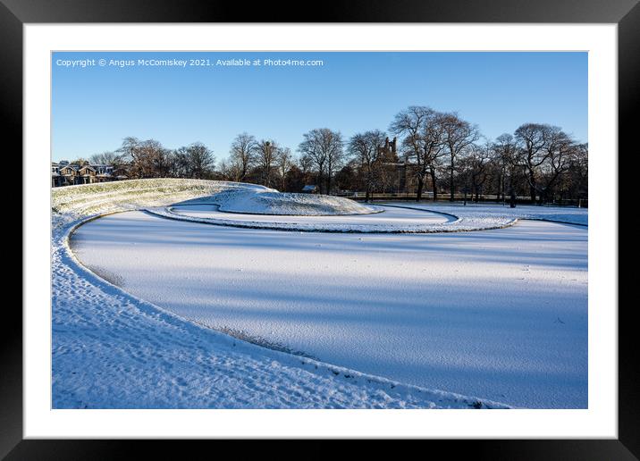 Sculptured landscape with ice and snow Framed Mounted Print by Angus McComiskey