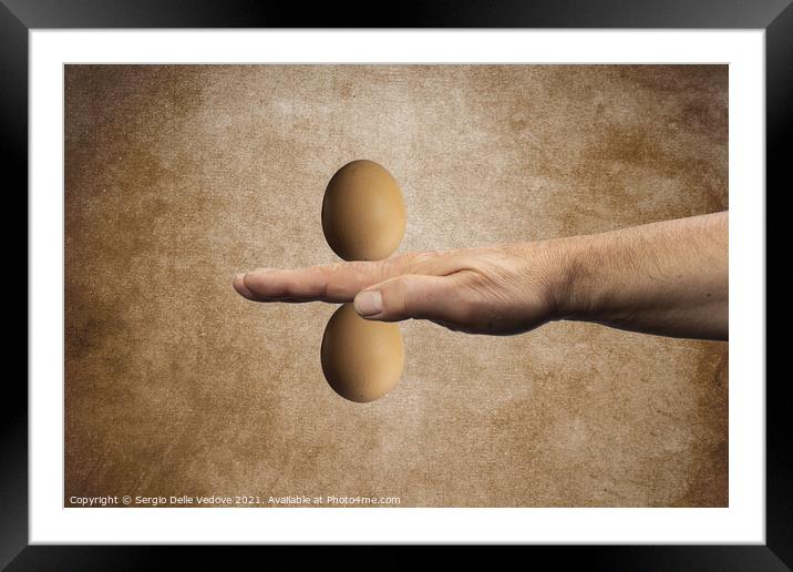 two eggs on the hand Framed Mounted Print by Sergio Delle Vedove