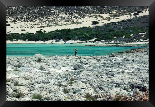 Crete or Kreta, Greece : A rear view of a girl standing in a nature lagoon in Balos Beach, Gramvousa Peninsula in Kreta island Framed Print by Arpan Bhatia