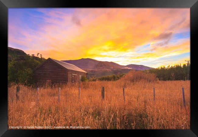 Sunrise over the Crown Mountains Framed Print by Kevin Hellon