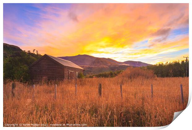 Sunrise over the Crown Mountains Print by Kevin Hellon