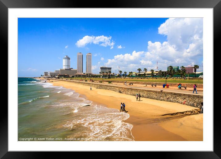 People walking on Galle Face beach Framed Mounted Print by Kevin Hellon