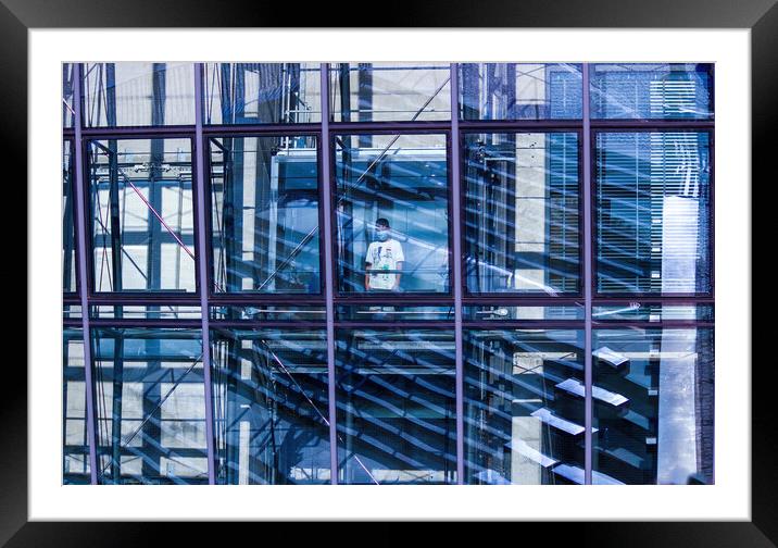 Gdansk, North Poland - August 15, 2020 A little kid wearing mask standing in an elevator inside transparent modern building Framed Mounted Print by Arpan Bhatia