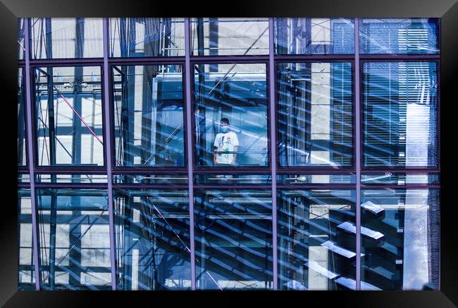 Gdansk, North Poland - August 15, 2020 A little kid wearing mask standing in an elevator inside transparent modern building Framed Print by Arpan Bhatia