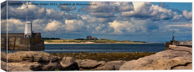Bamburgh Castle viewed from Seahouses Canvas Print by Andrew Heaps