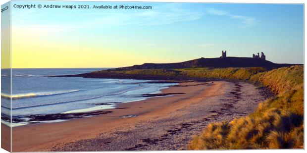 Sunset scene looking towards Dunstanburgh Castle. Canvas Print by Andrew Heaps