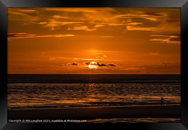 The Sun goes down over Liverpool Bay Framed Print by Phil Longfoot