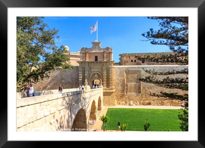 Tourists using the bridge across to the Mdina. Framed Mounted Print by Kevin Hellon