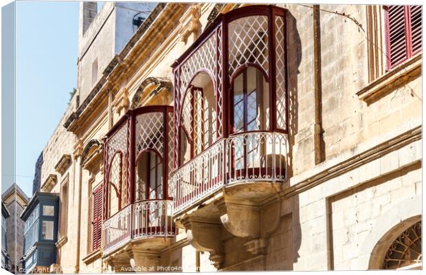 Traditional balconies in Valletta Canvas Print by Kevin Hellon