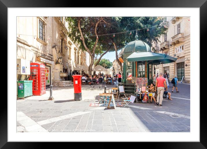 Square with cafe and kiosk.  Framed Mounted Print by Kevin Hellon