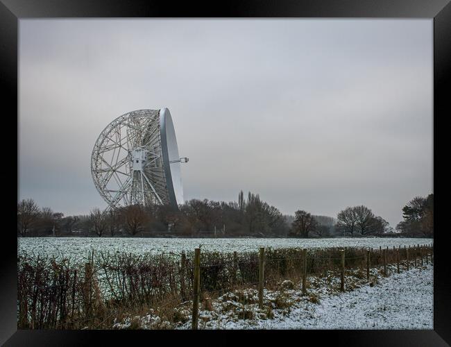 Jodrell Bank in a snow covered field  Framed Print by Vicky Outen