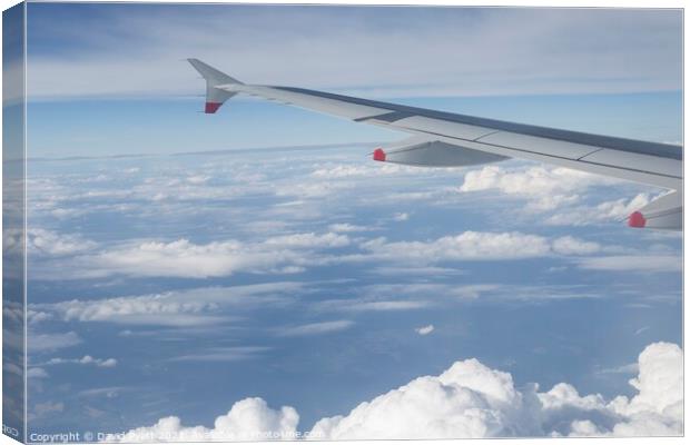 Flying Over Cotton Wool Clouds  Canvas Print by David Pyatt