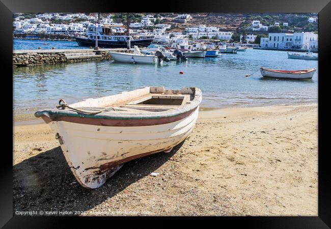 Small boat beached on sand  Framed Print by Kevin Hellon