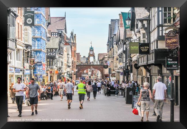 Shoppers walking in Eastgate street Framed Print by Kevin Hellon