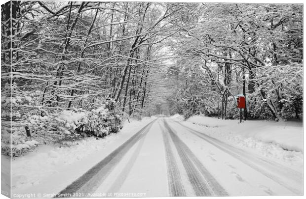 Snowy Road with Bright Red Postbox Canvas Print by Sarah Smith