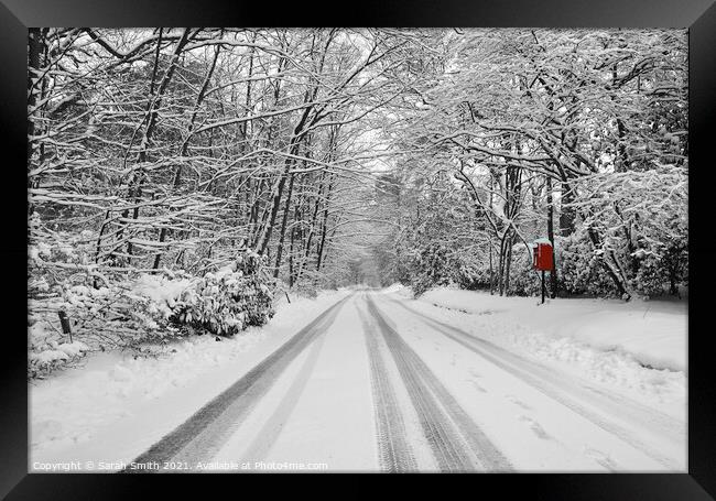 Snowy Road with Bright Red Postbox Framed Print by Sarah Smith