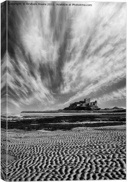 Bamburgh Castle with streaky clouds monochrome Canvas Print by Graham Moore
