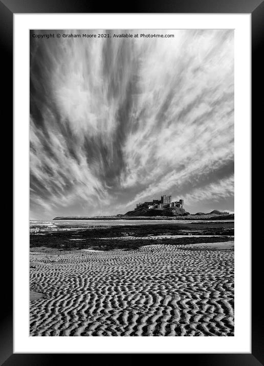 Bamburgh Castle with streaky clouds monochrome Framed Mounted Print by Graham Moore