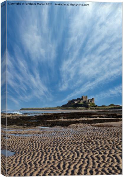 Bamburgh Castle with streaky clouds Canvas Print by Graham Moore