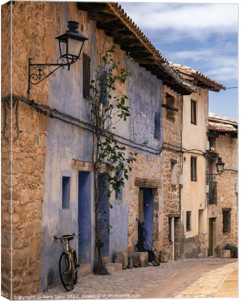 bicycle leaning on a wall in Valderrobres, Teruel Canvas Print by Pere Sanz