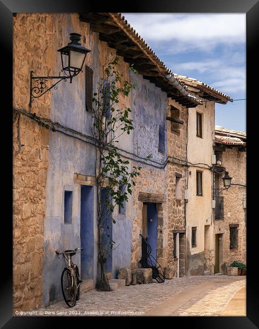 bicycle leaning on a wall in Valderrobres, Teruel Framed Print by Pere Sanz
