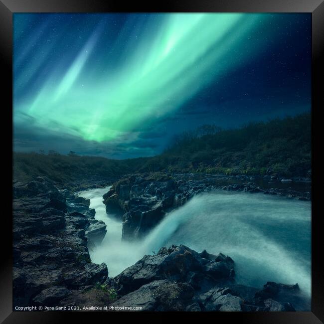 Aurora Borealis over a River in Iceland Framed Print by Pere Sanz
