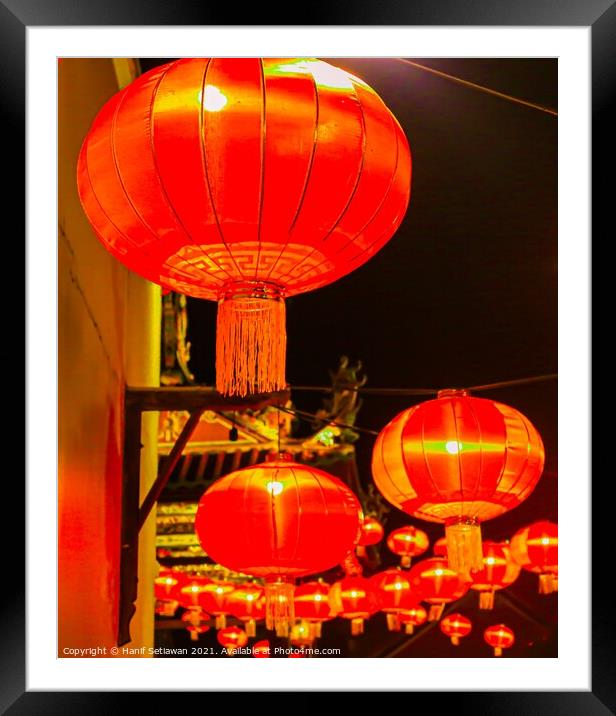 Red lantern as street lights hanging at a wall for Chinese New Year Framed Mounted Print by Hanif Setiawan
