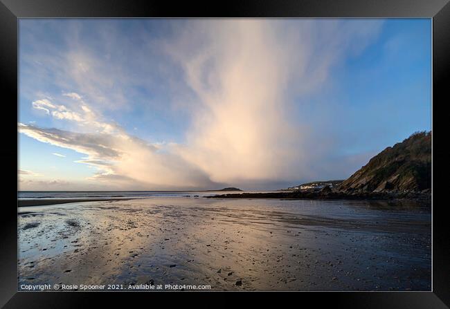 Rain clouds gather at Looe island in Cornwall Framed Print by Rosie Spooner