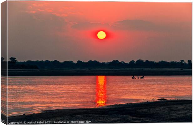 Sunsetting by river, Zambia, Africa Canvas Print by Mehul Patel