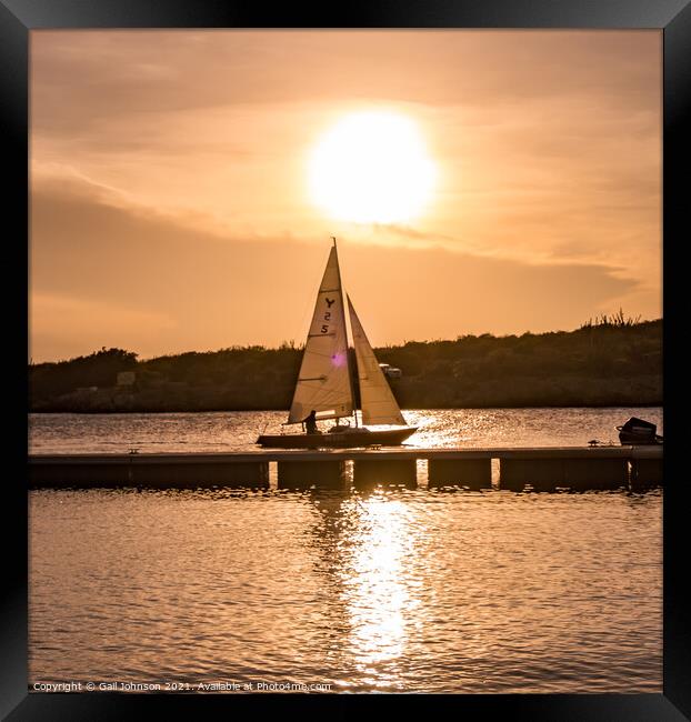 Sailboat at sunset  Framed Print by Gail Johnson