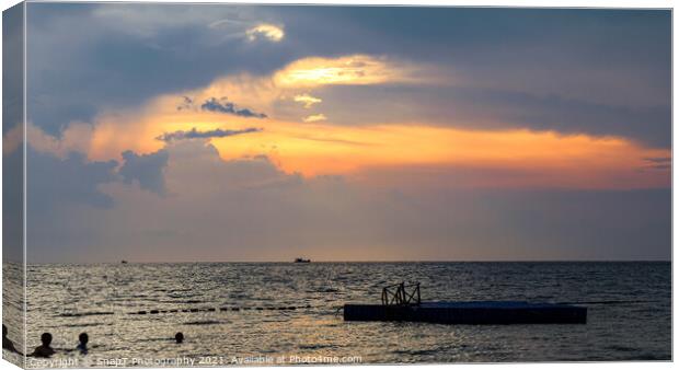 Silhouette of bathers and floating pier at sunset  Canvas Print by SnapT Photography