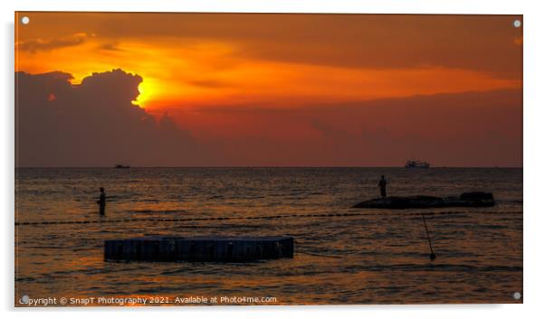 A silhouette of fishermen standing on rocks at sun Acrylic by SnapT Photography